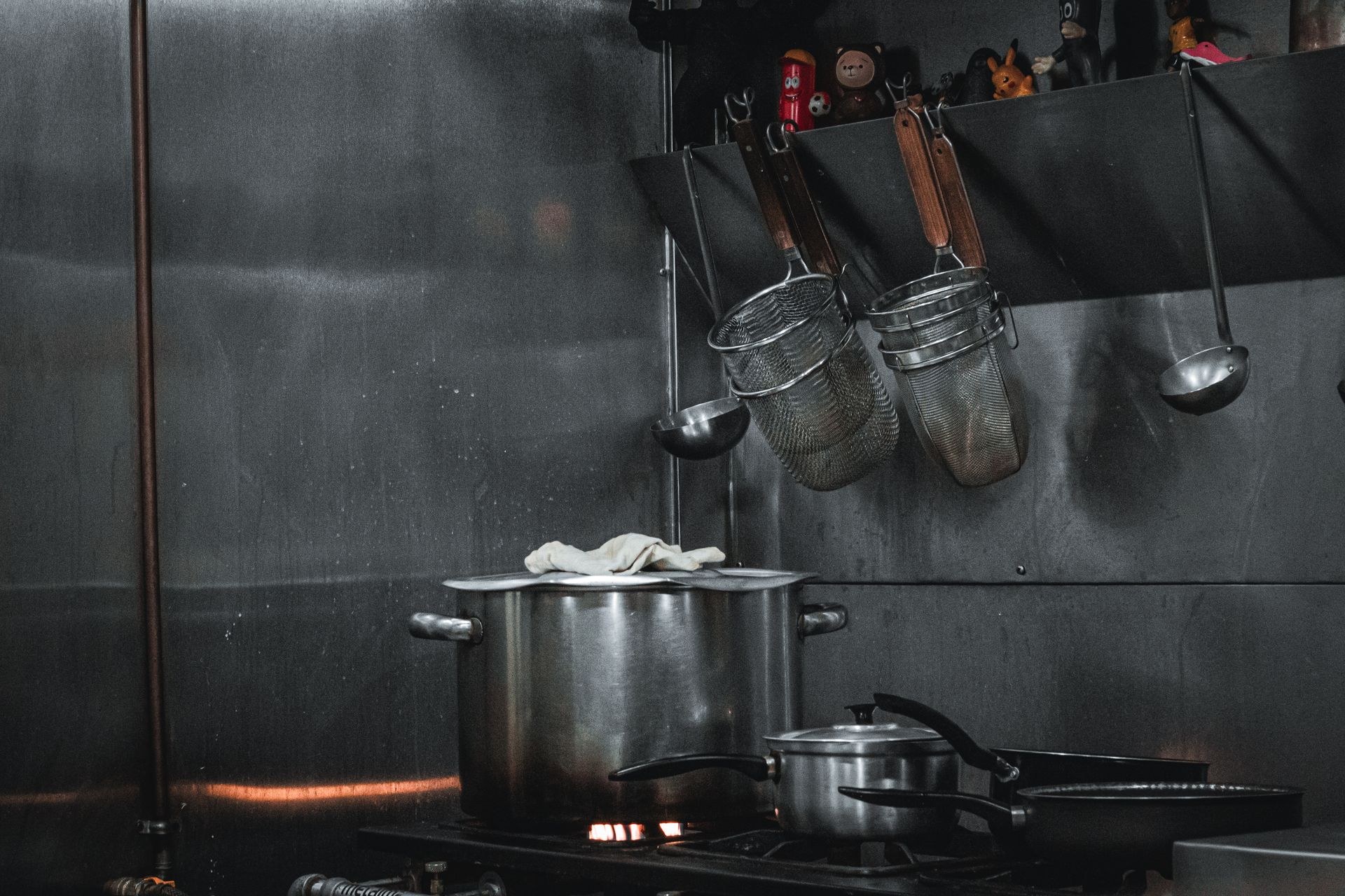 Complete stainless steel cookware set in retail-ready packaging box