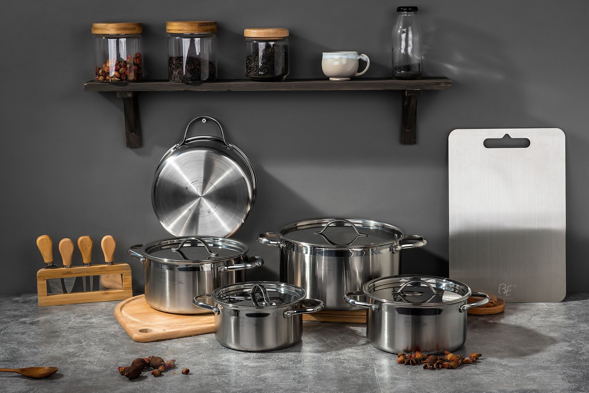 Stainless steel cookware set arranged for product photography